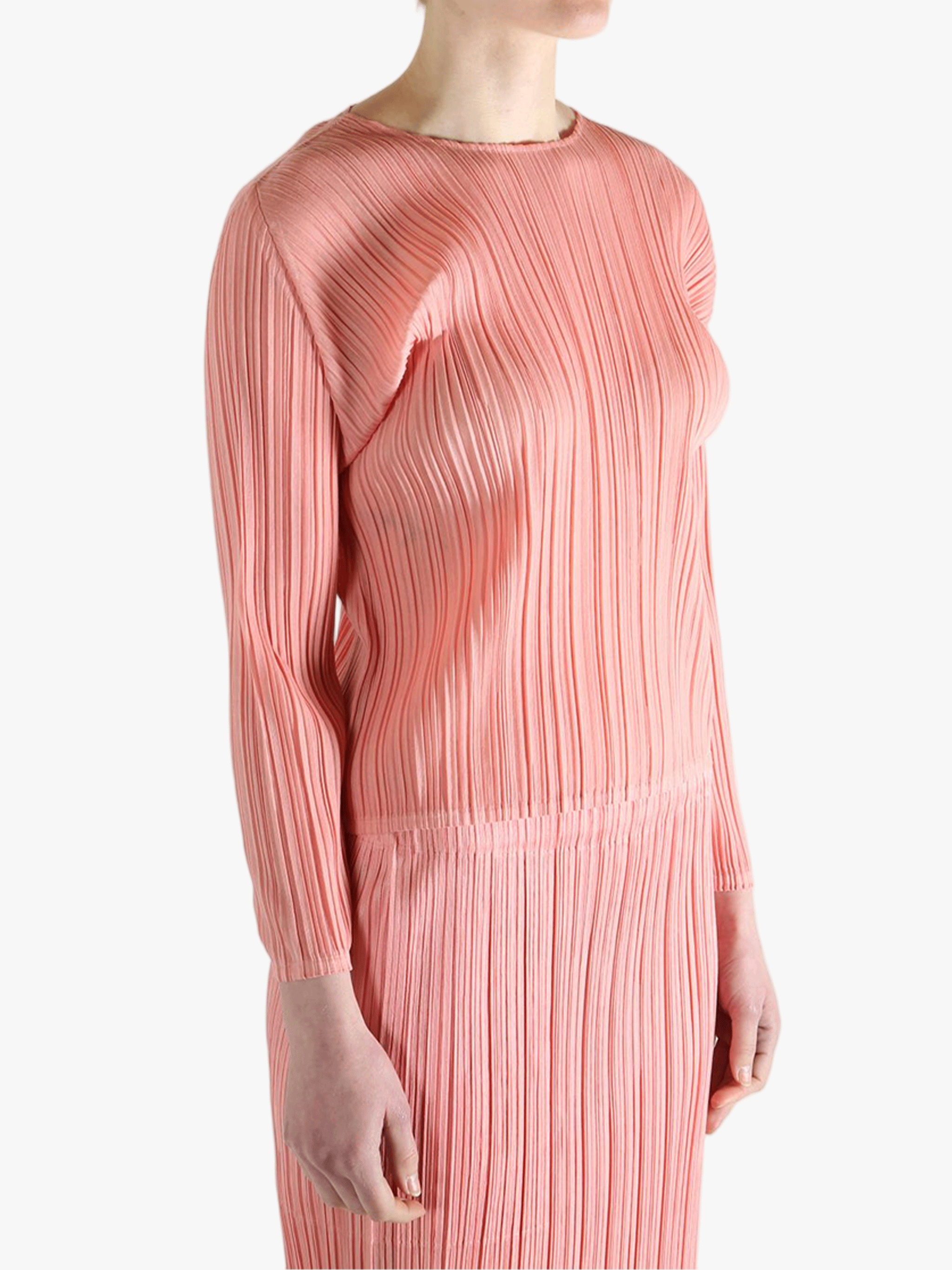 Pink shirt worn by a person, showing the shirt's fit