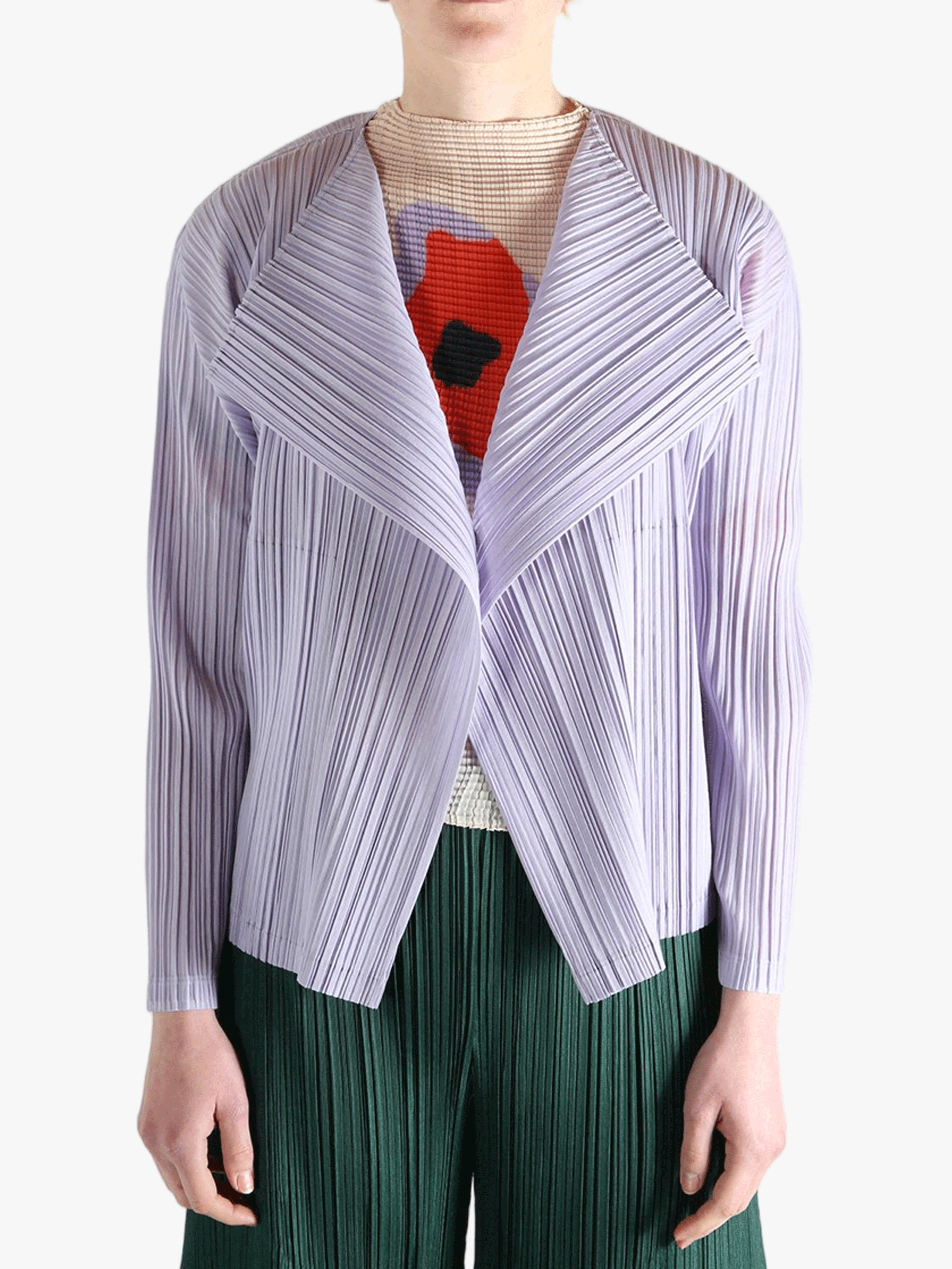 Purple knitwear worn by a person, showing the knitwear fit