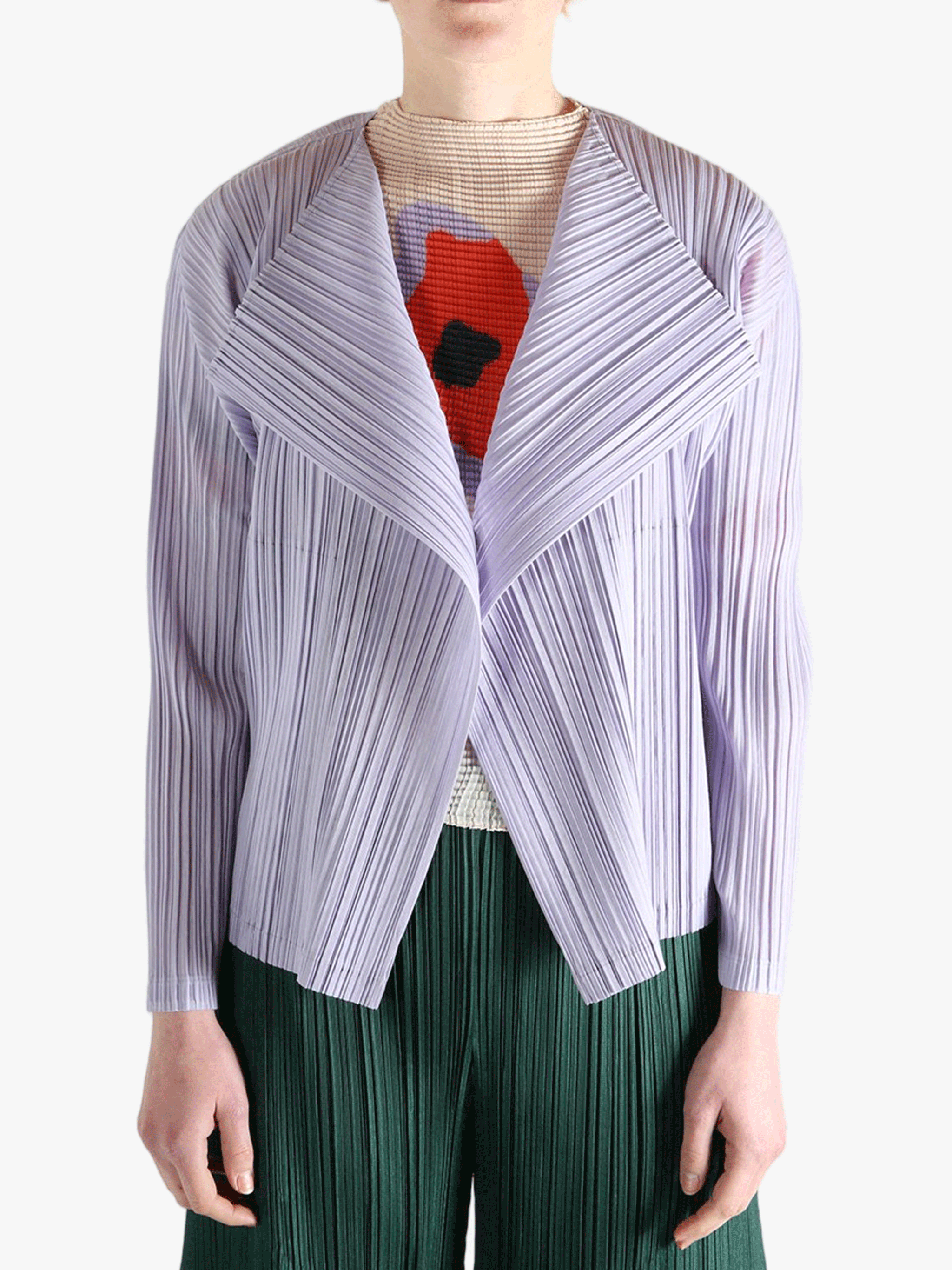 Purple knitwear worn by a person, showing the knitwear fit