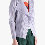 Purple knitwear worn by a person, showing the knitwear fit