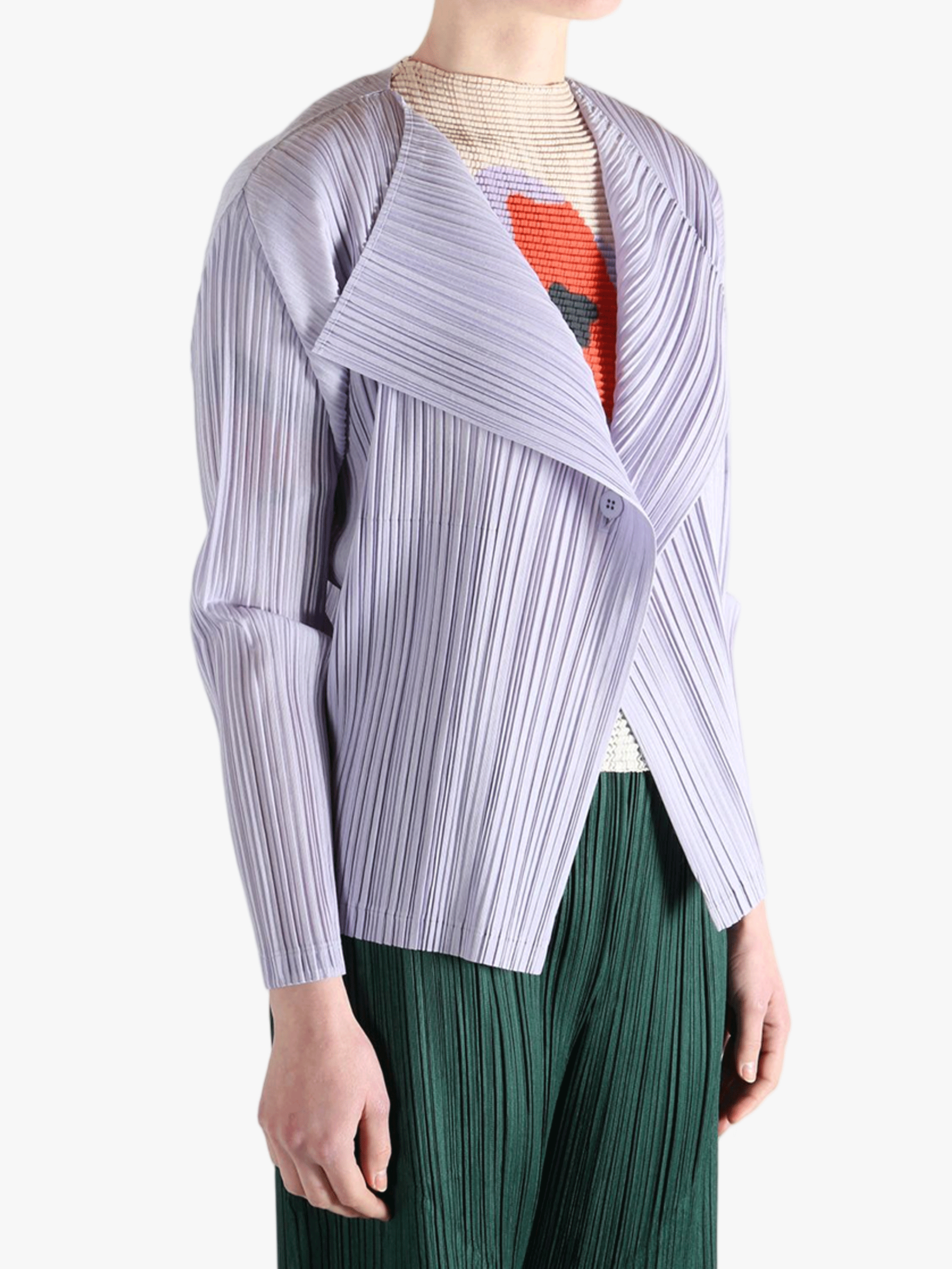 Purple knitwear worn by a person, showing the knitwear fit