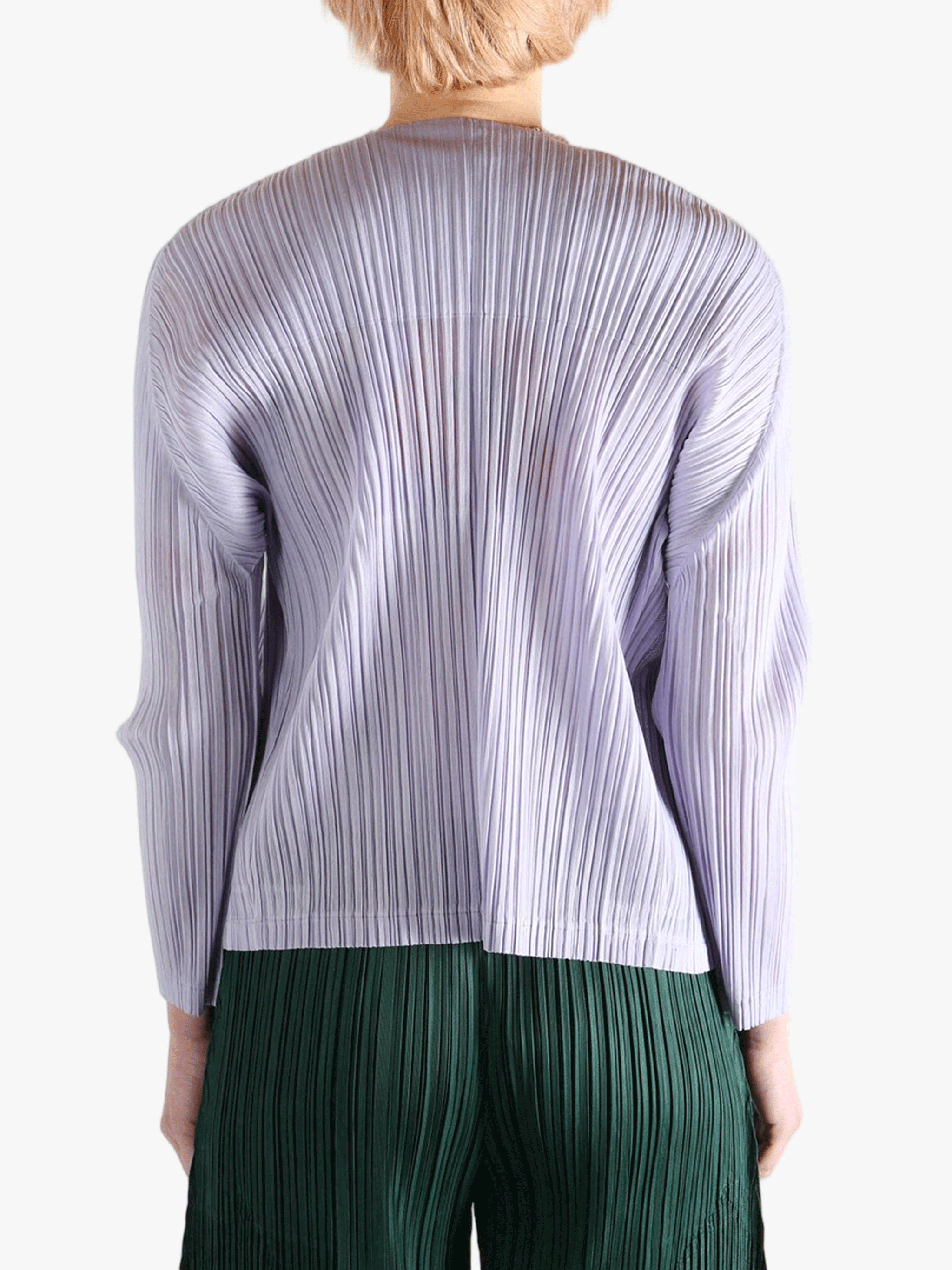 Purple knitwear worn by a person, showing the knitwear fit