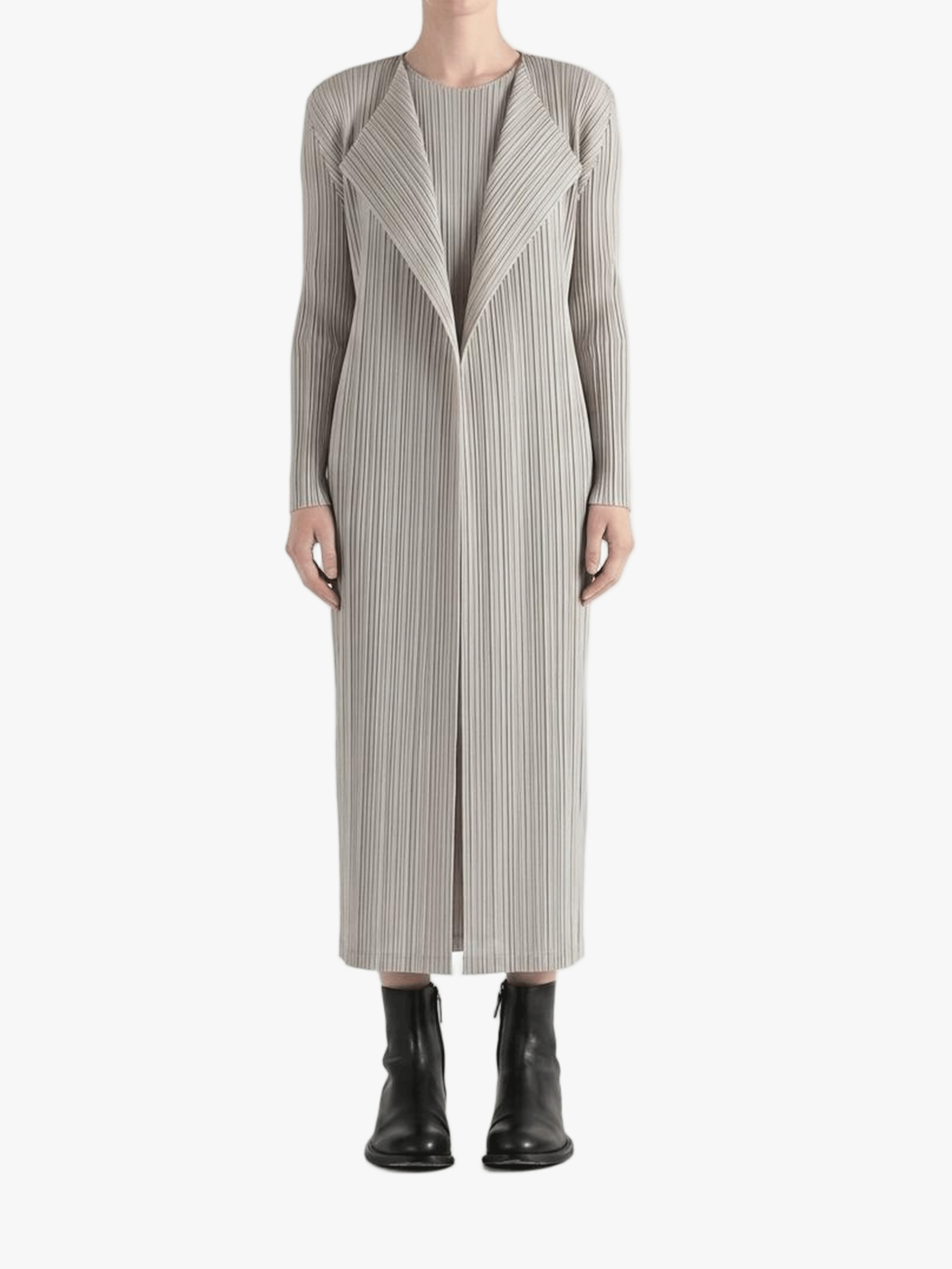 Grey knitwear worn by a person, showing the knitwear fit