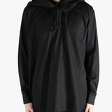 Black hoodie worn by a person, showing the hoodie's fit