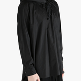 Black hoodie worn by a person, showing the hoodie's fit