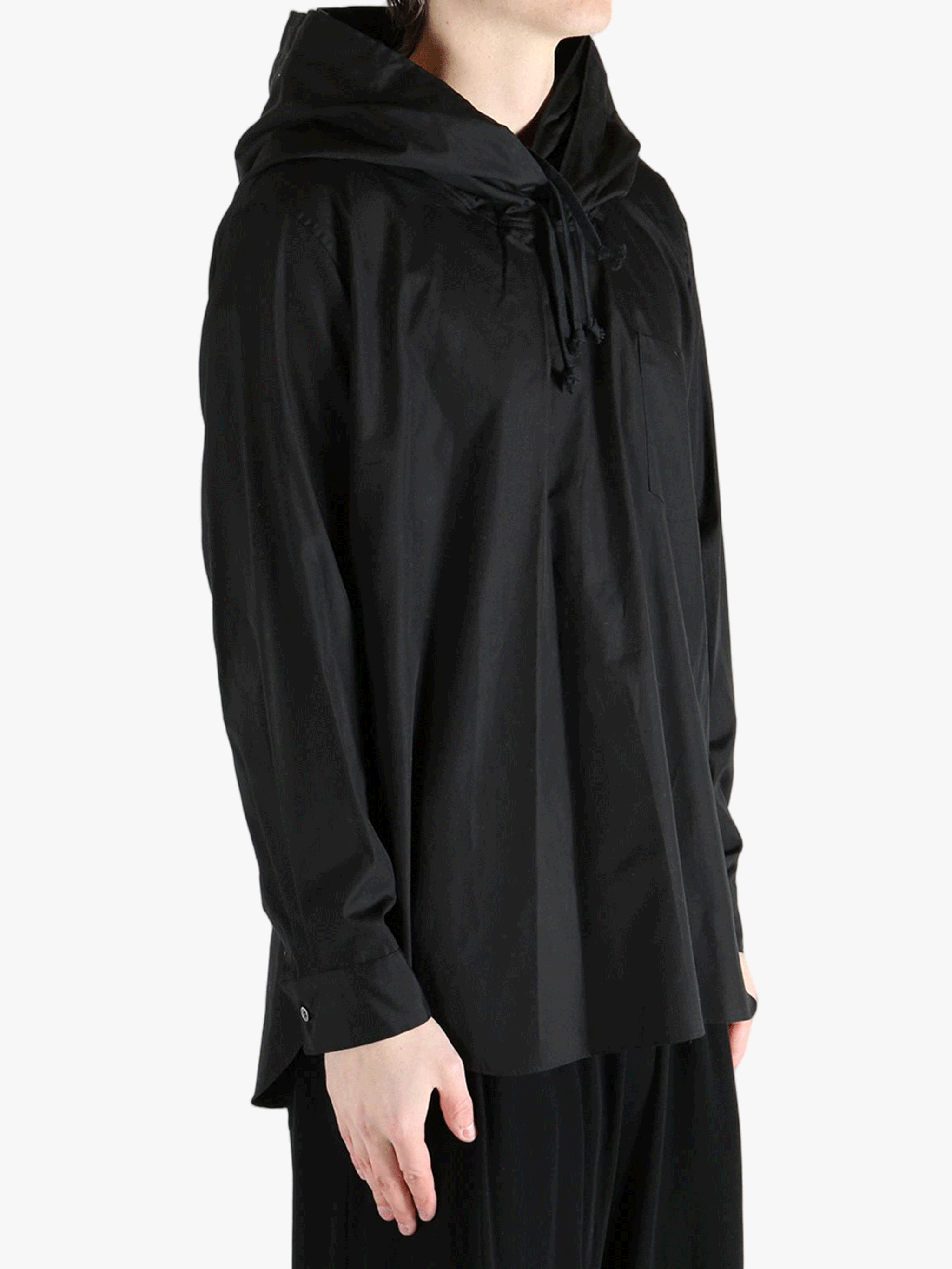 Black hoodie worn by a person, showing the hoodie's fit