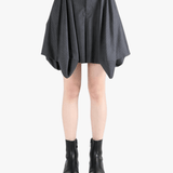 Grey shorts worn by a person, showing the shorts fit