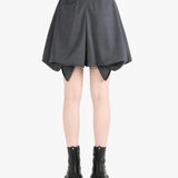 Grey shorts worn by a person, showing the shorts fit