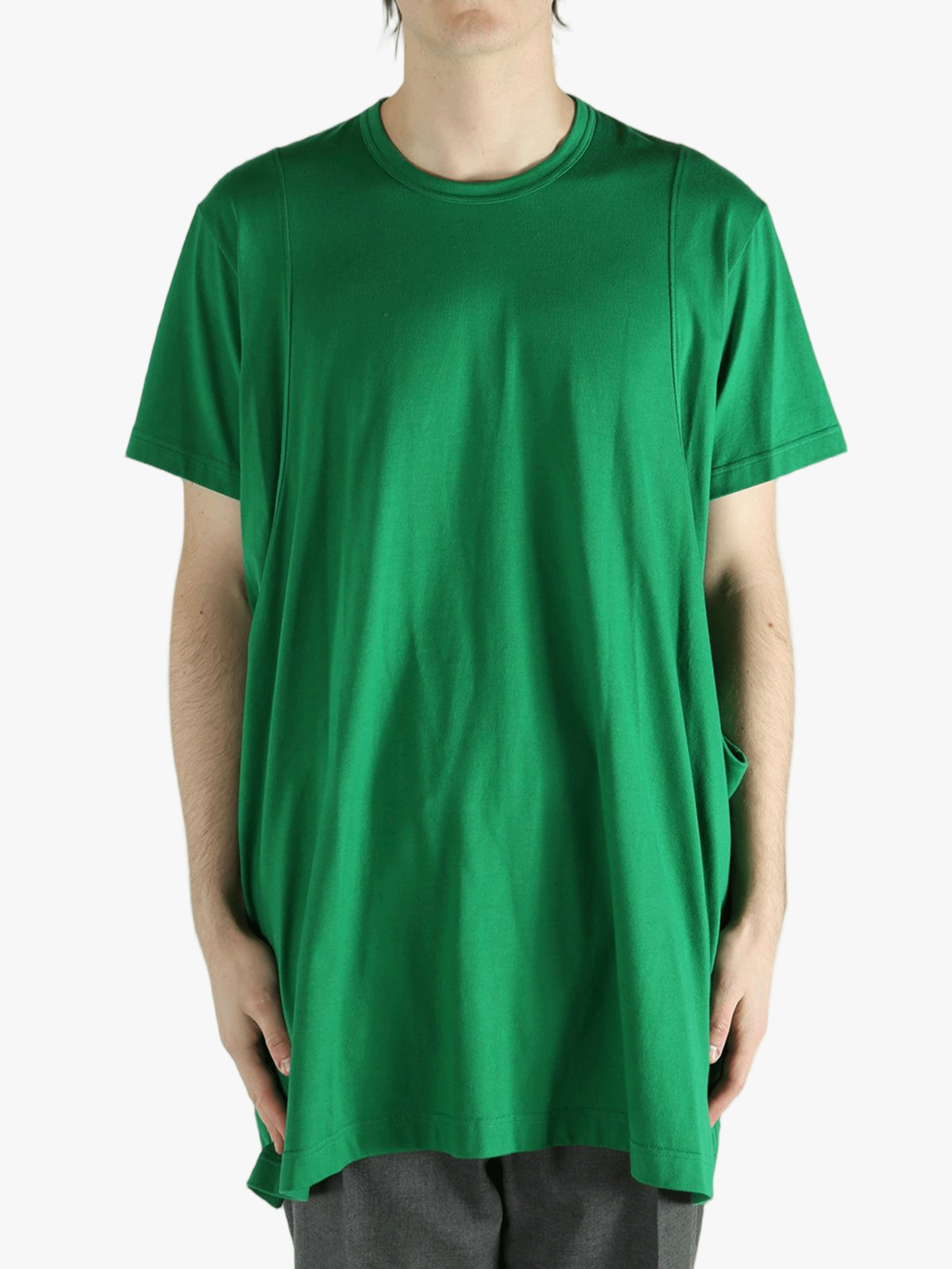 Green t-shirt worn by a person, showing the shirt's fit