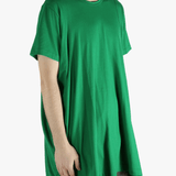 Green t-shirt worn by a person, showing the shirt's fit