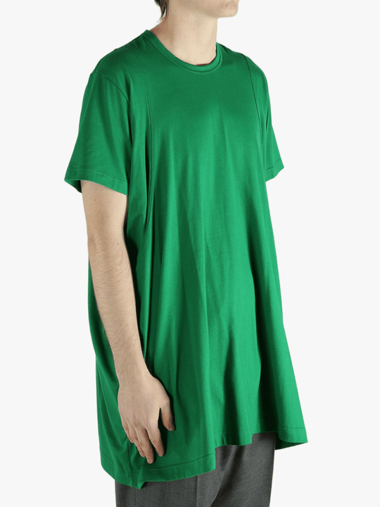Green t-shirt worn by a person, showing the shirt's fit