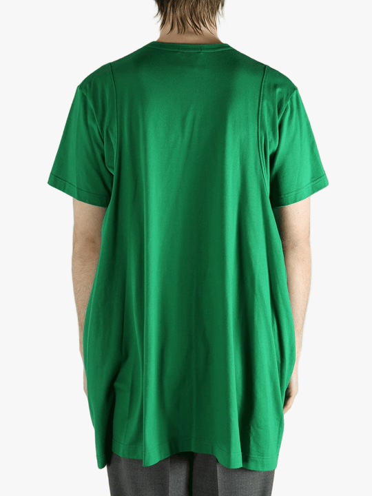 Green t-shirt worn by a person, showing the shirt's fit