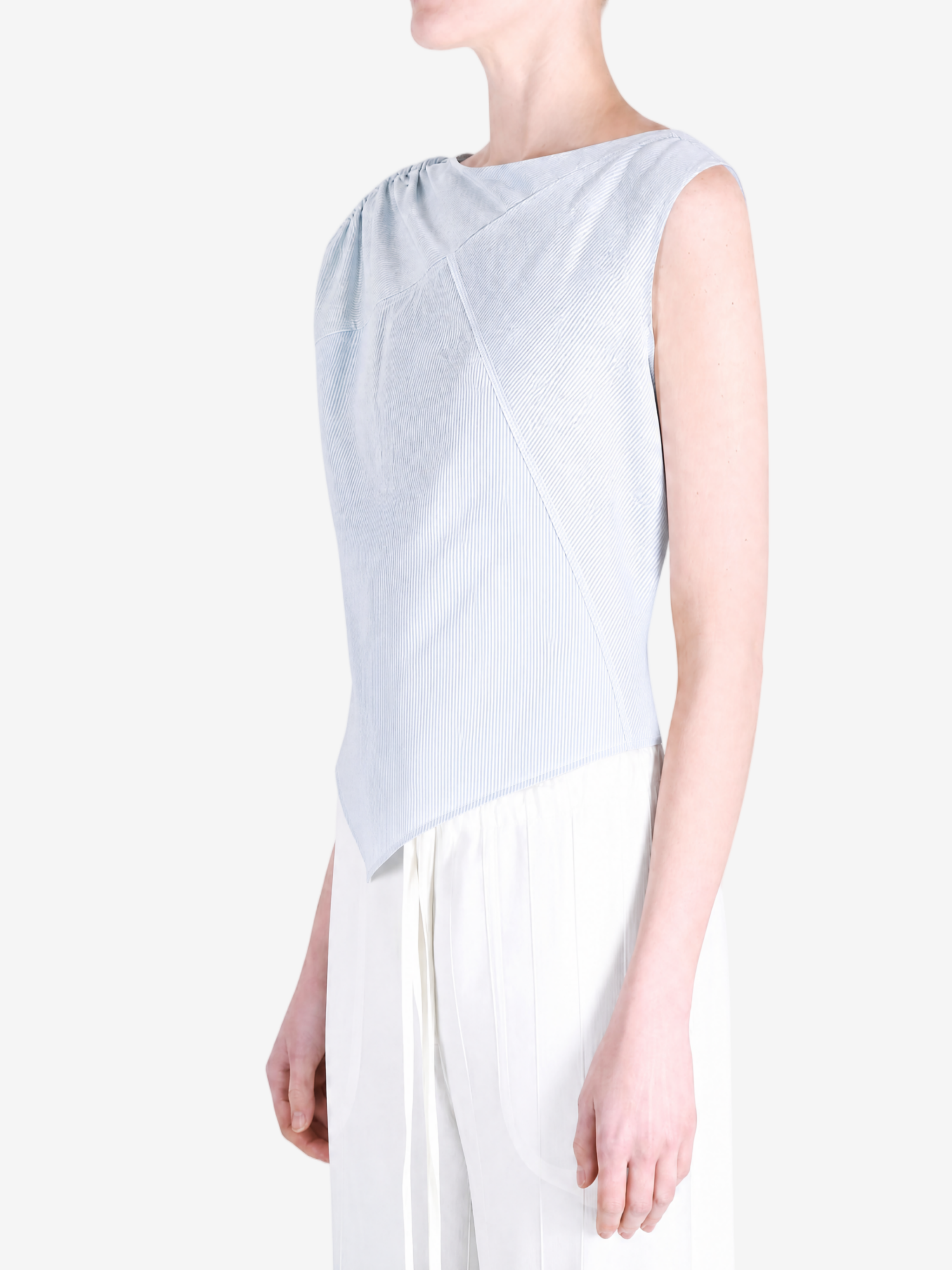 Blue top worn by a person, showing the top fit