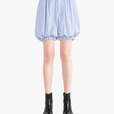 Blue shorts worn by a person, showing the shorts fit