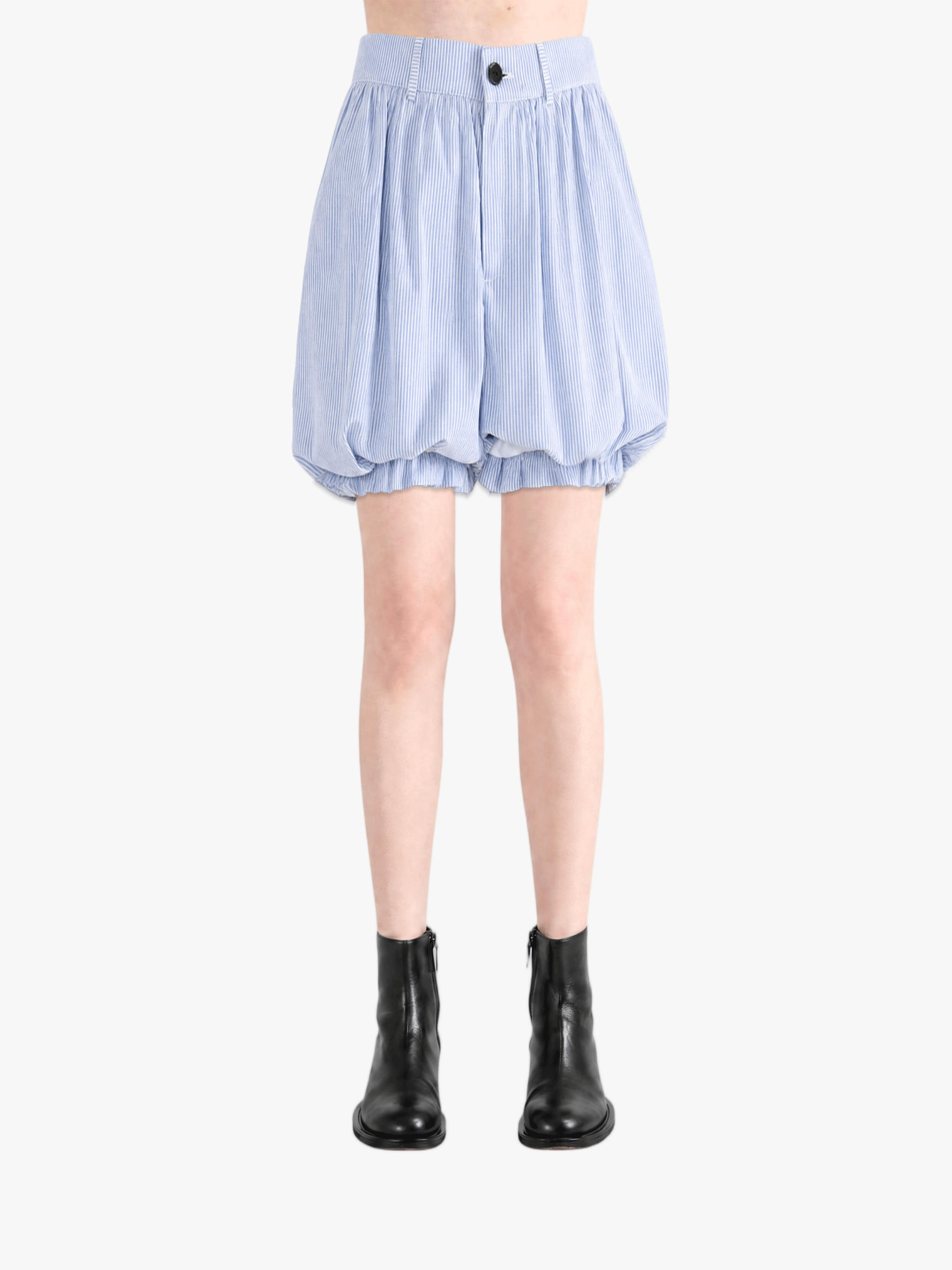 Blue shorts worn by a person, showing the shorts fit