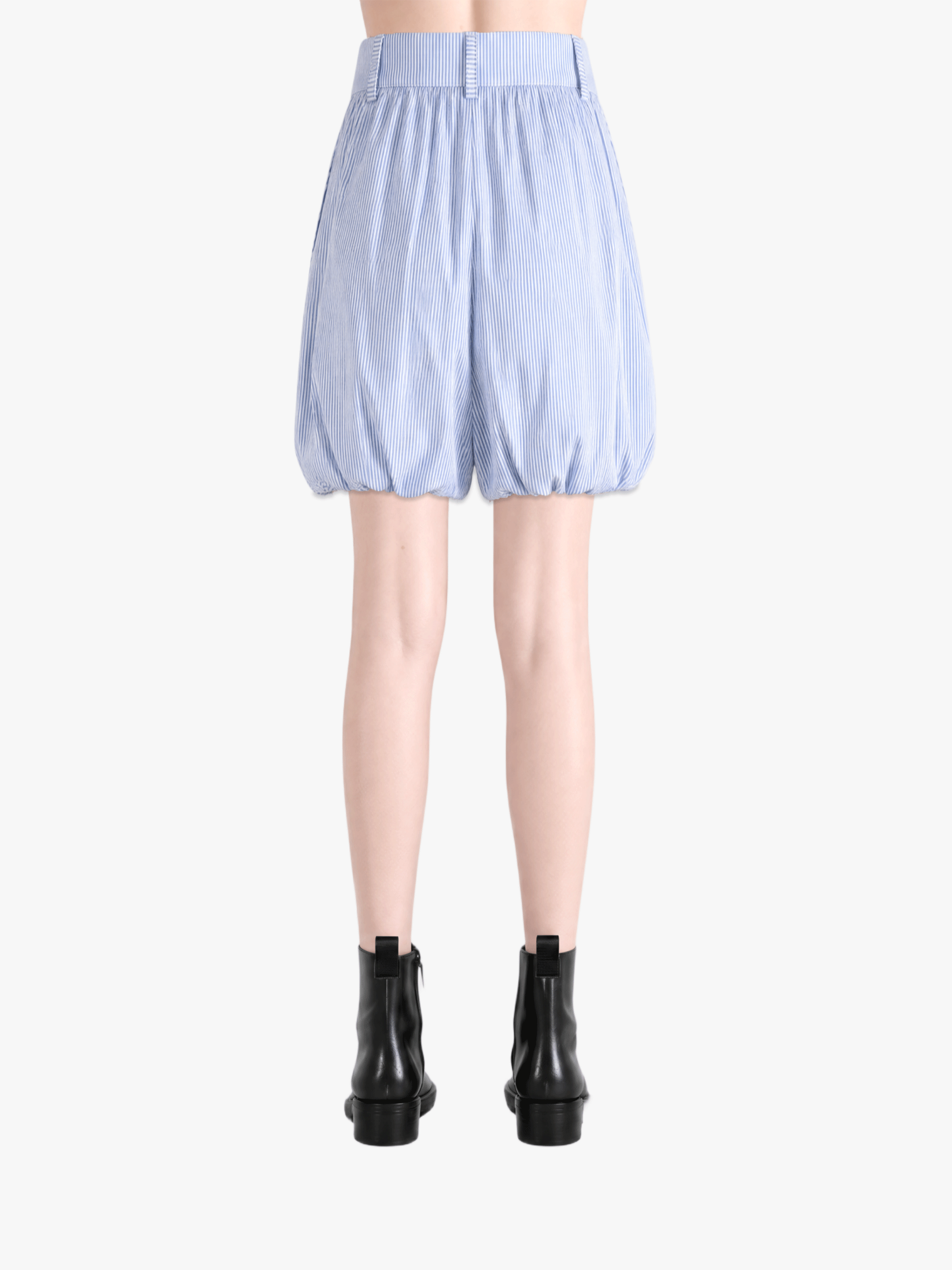 Blue shorts worn by a person, back view