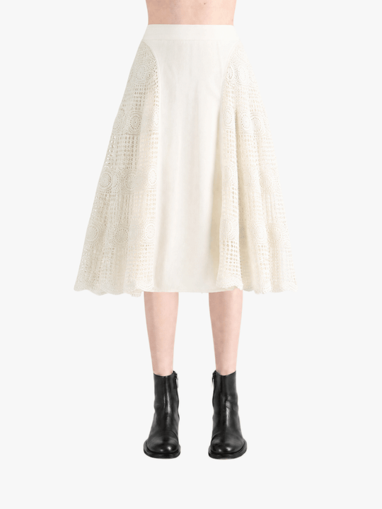 Tan skirt worn by a person, showing the skirt fit