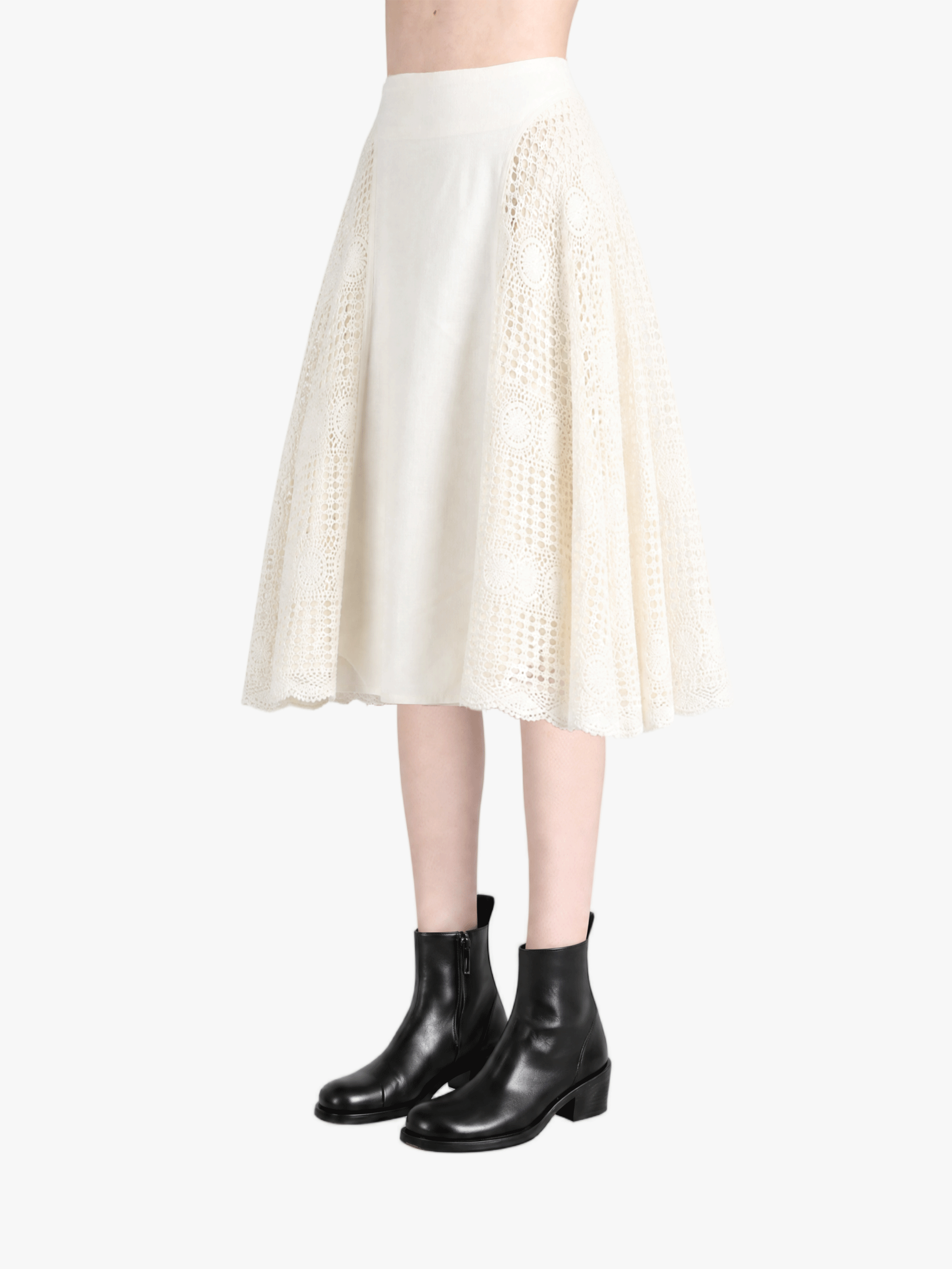 Tan skirt worn by a person, side view