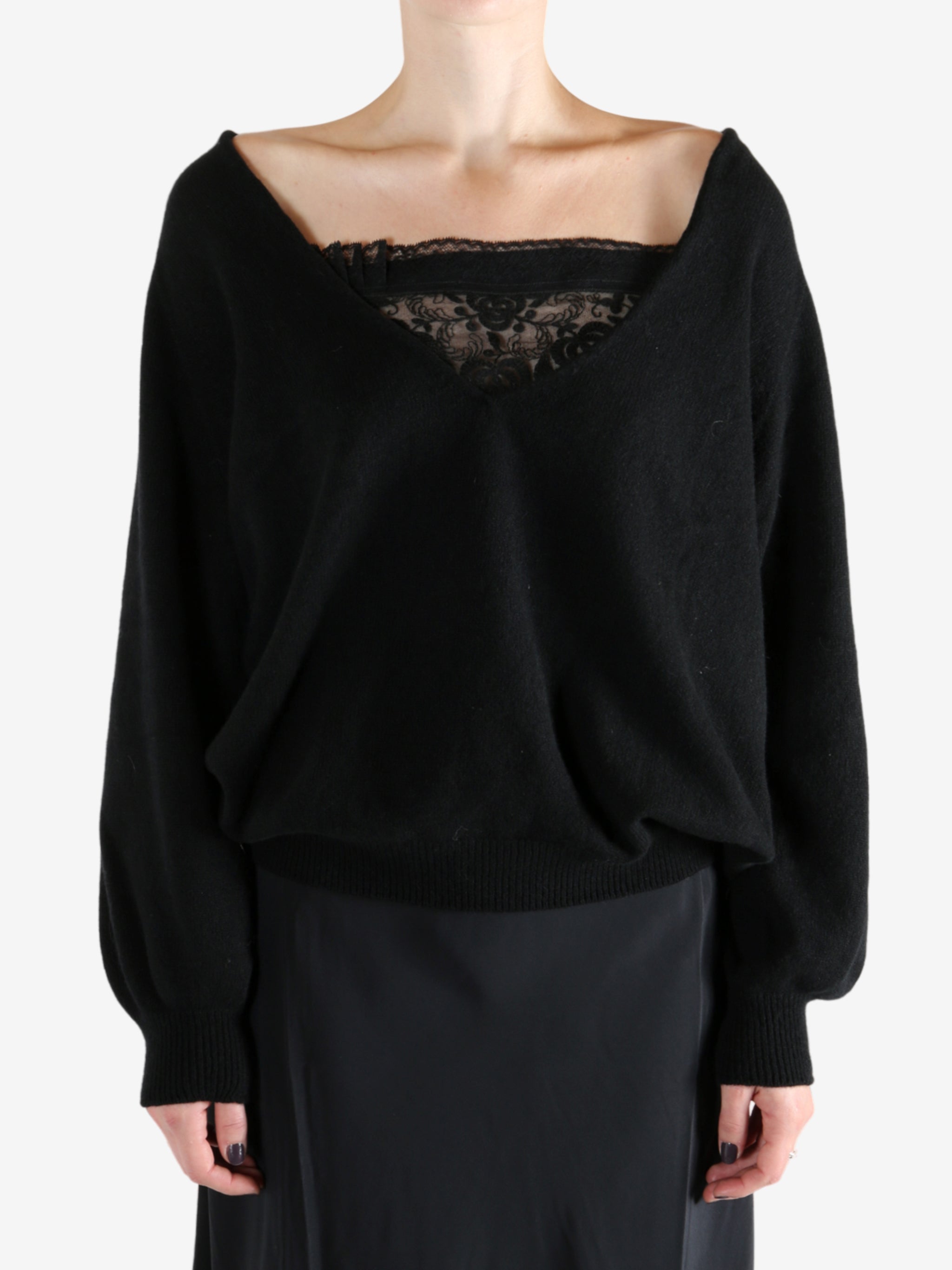 Black sweatshirt worn by a person, showing the sweatshirt fit