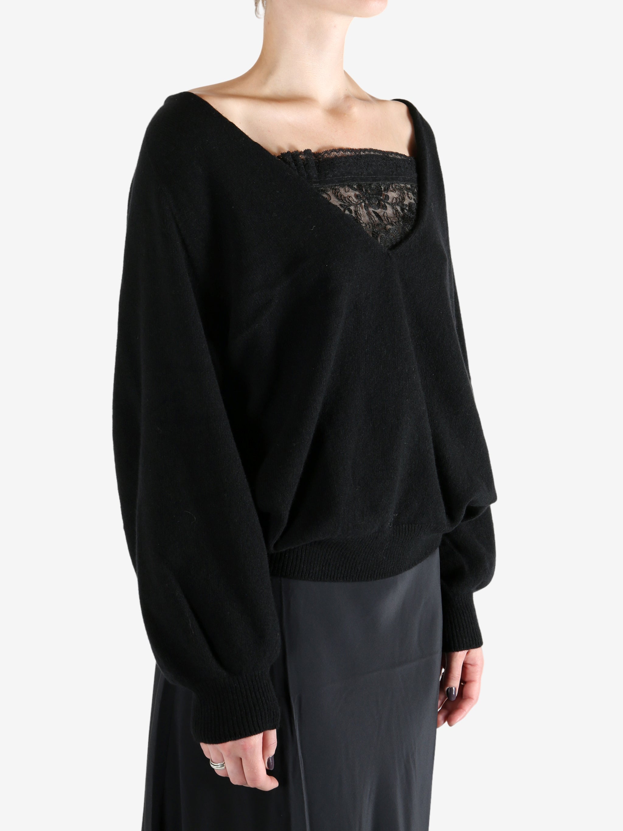 Black sweatshirt worn by a person, showing the sweatshirt fit