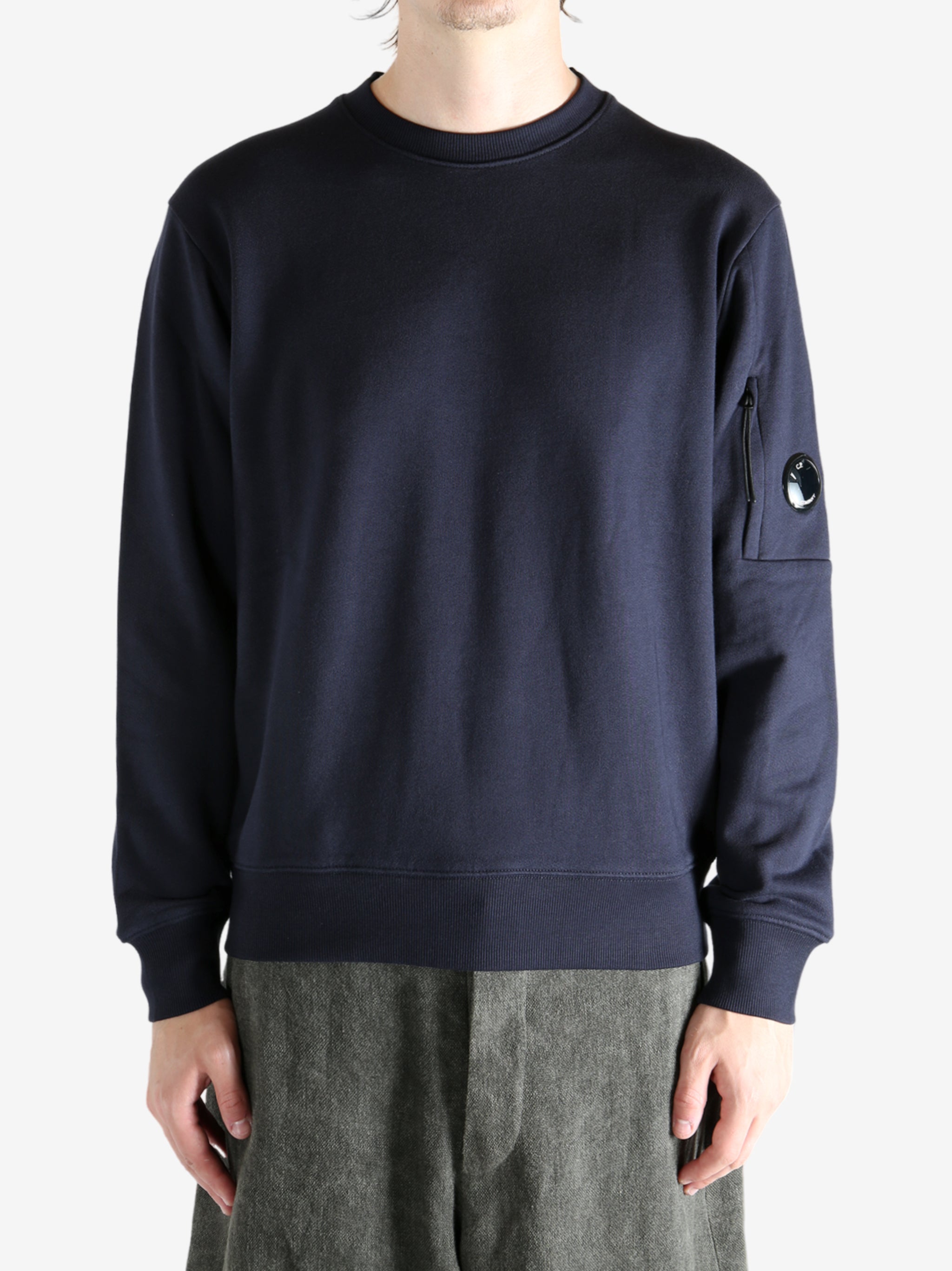 Blue sweatshirt worn by a person, showing the sweats' fit