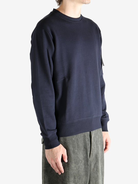 Blue sweatshirt worn by a person, showing the sweats' fit