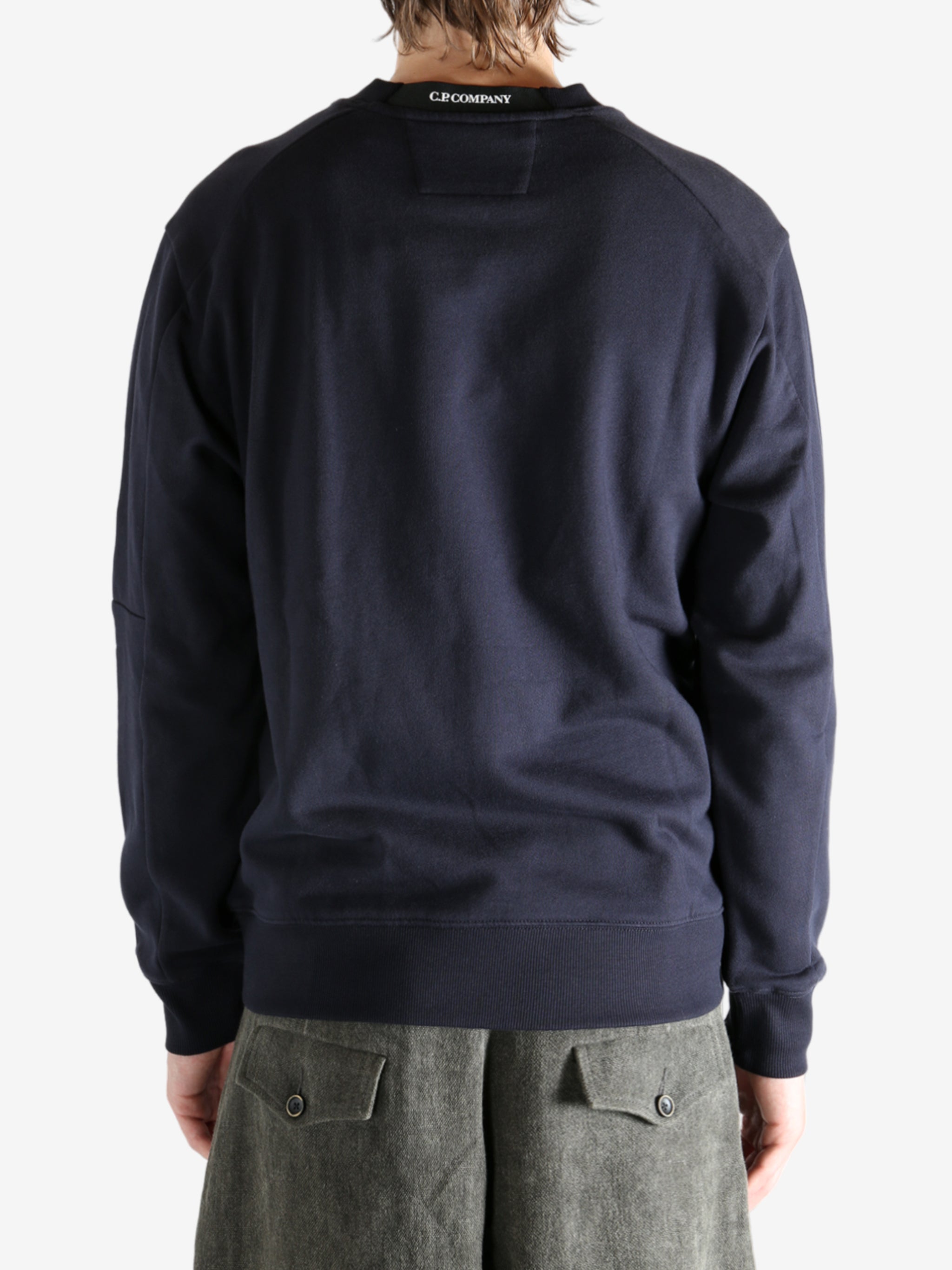 Blue sweatshirt worn by a person, showing the sweats' fit