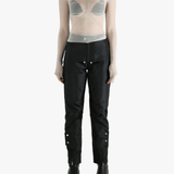 Grey tops worn by a person, showing the tight fit