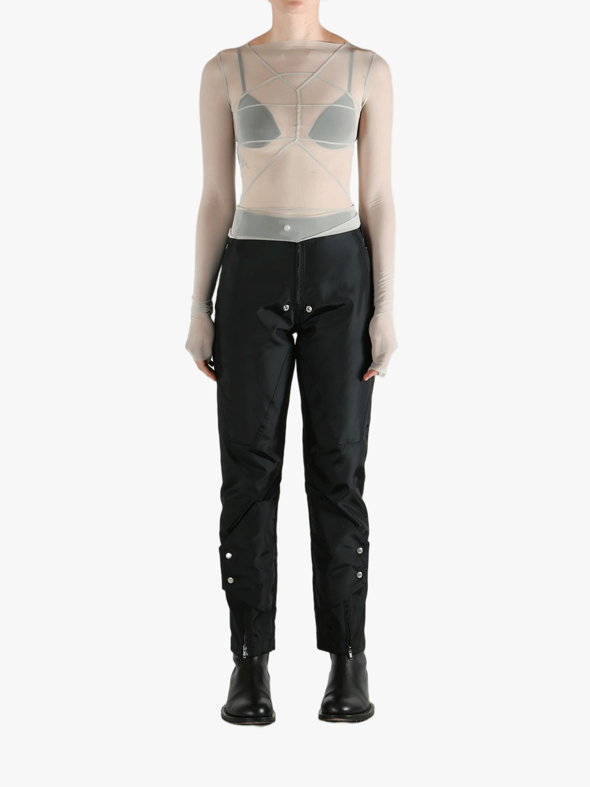 Grey tops worn by a person, showing the tight fit
