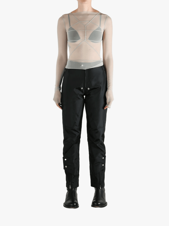Grey tops worn by a person, showing the tight fit
