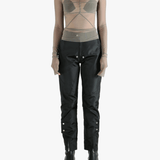 Grey tops worn by a person, showing the tight fit