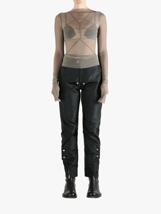 Grey tops worn by a person, showing the tight fit