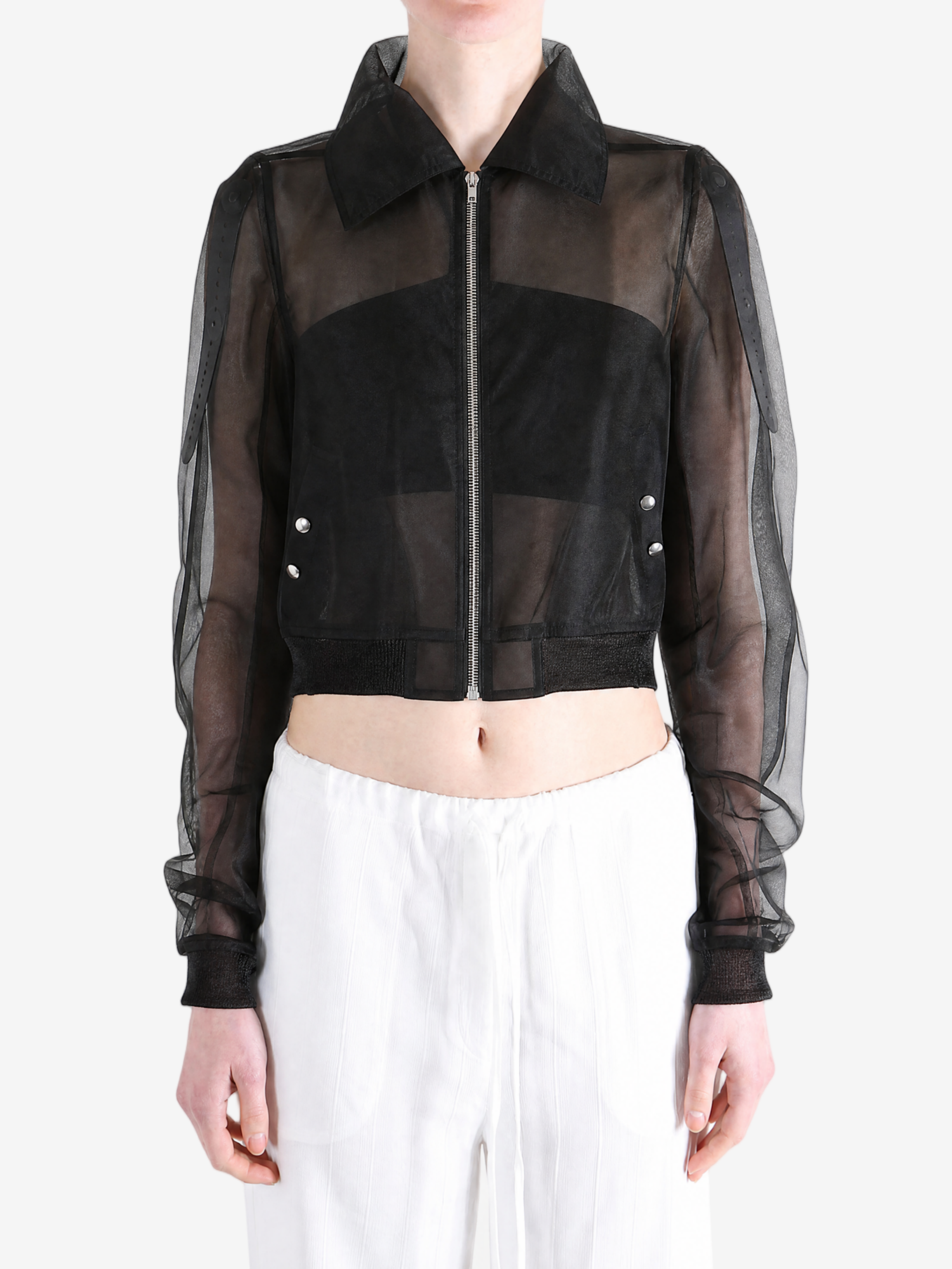 Black jacket worn by a person, showing the jacket fit