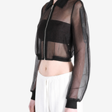 Black jacket worn by a person, side view