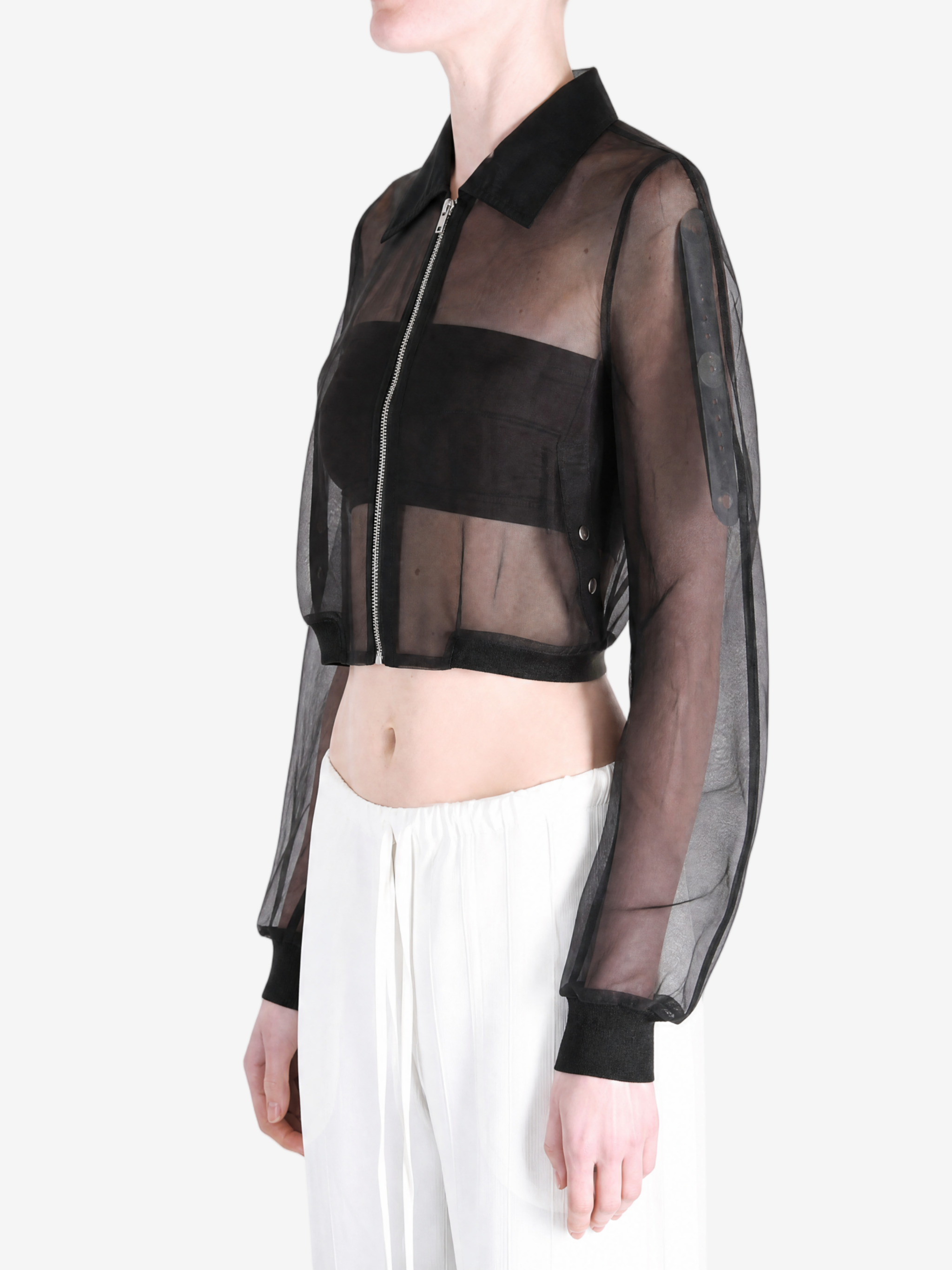Black jacket worn by a person, side view