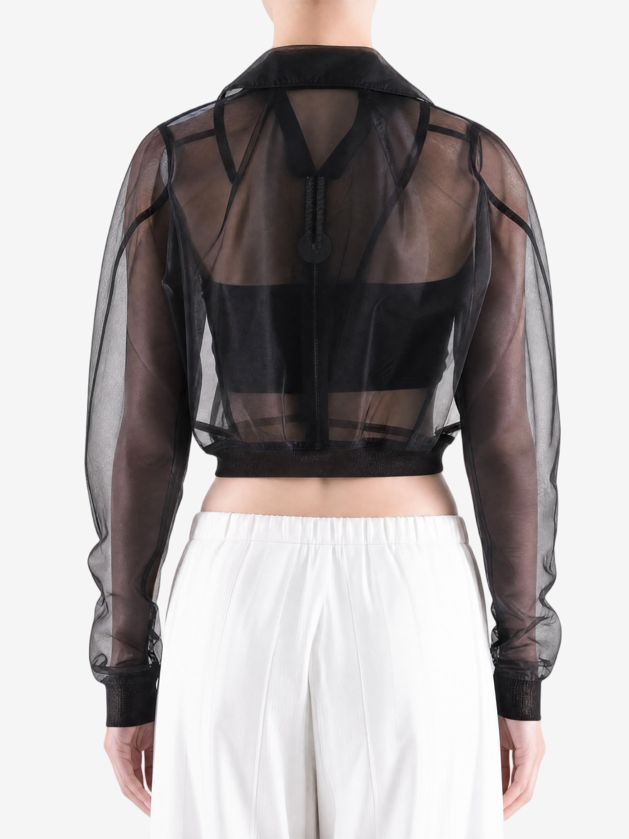 Black jacket worn by a person, back view