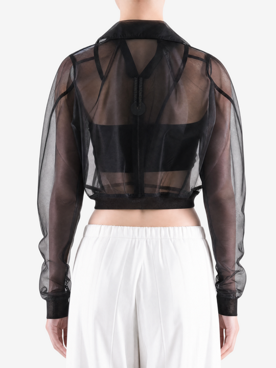 Black jacket worn by a person, back view