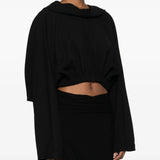 Black top  worn by a person, showing the top's fit