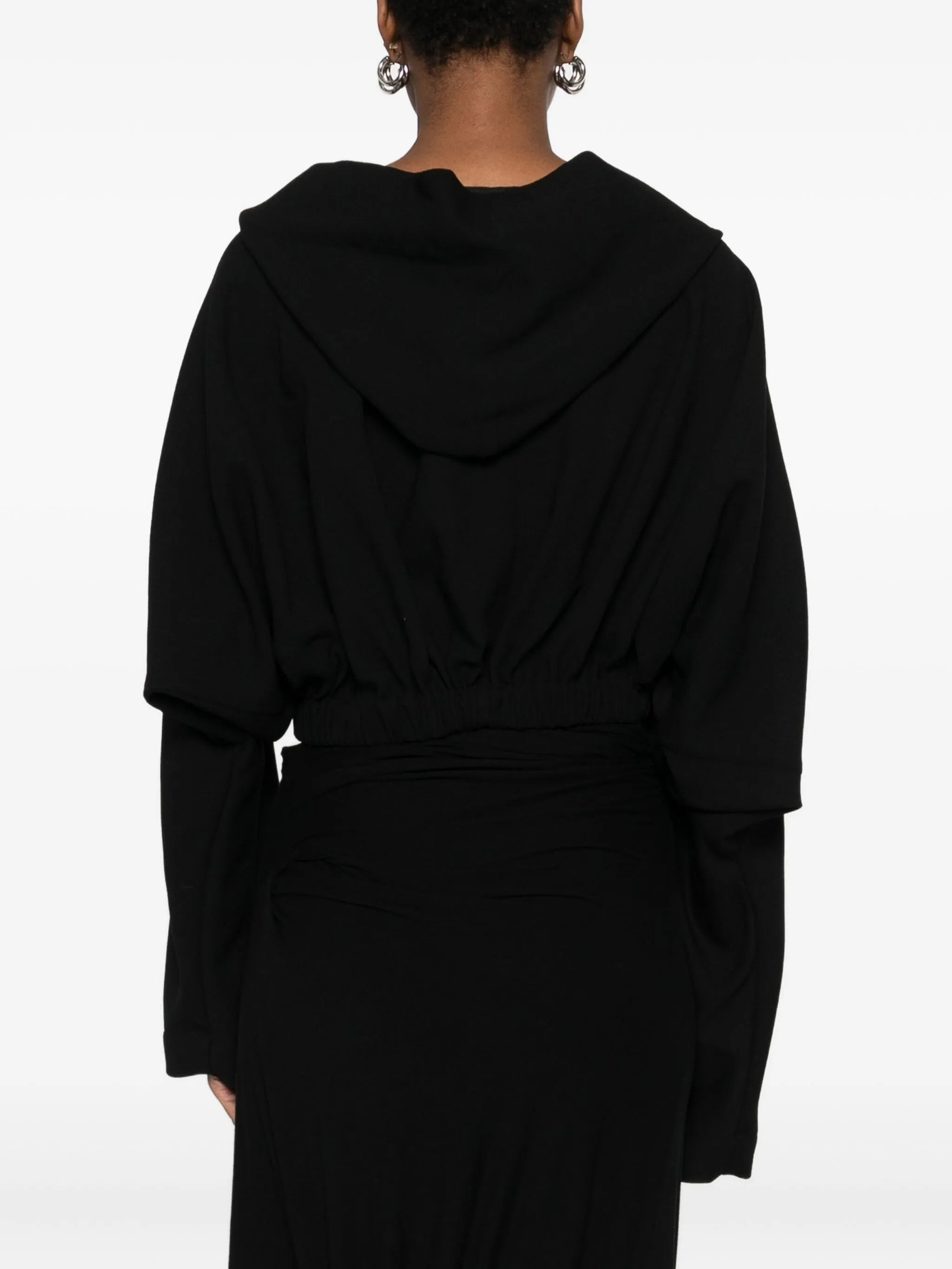 Black top  worn by a person, showing the top's fit