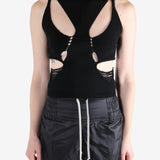 Black top worn by a person, showing the tops's fit