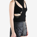 Black top worn by a person, showing the tops's fit