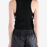 Black top worn by a person, showing the tops's fit