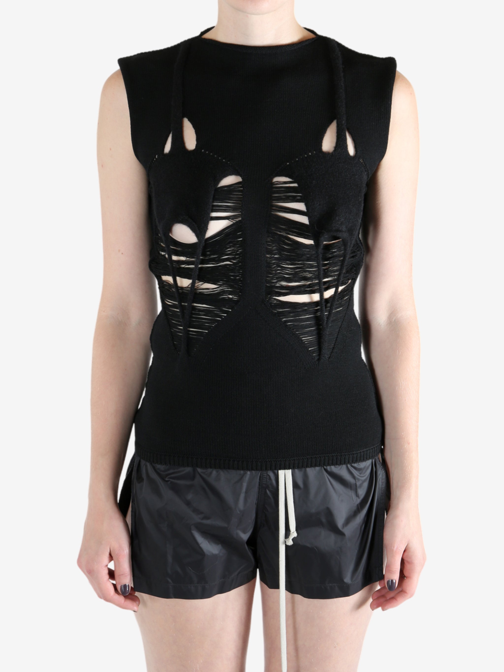 Black top worn by a person, showing the top's fit