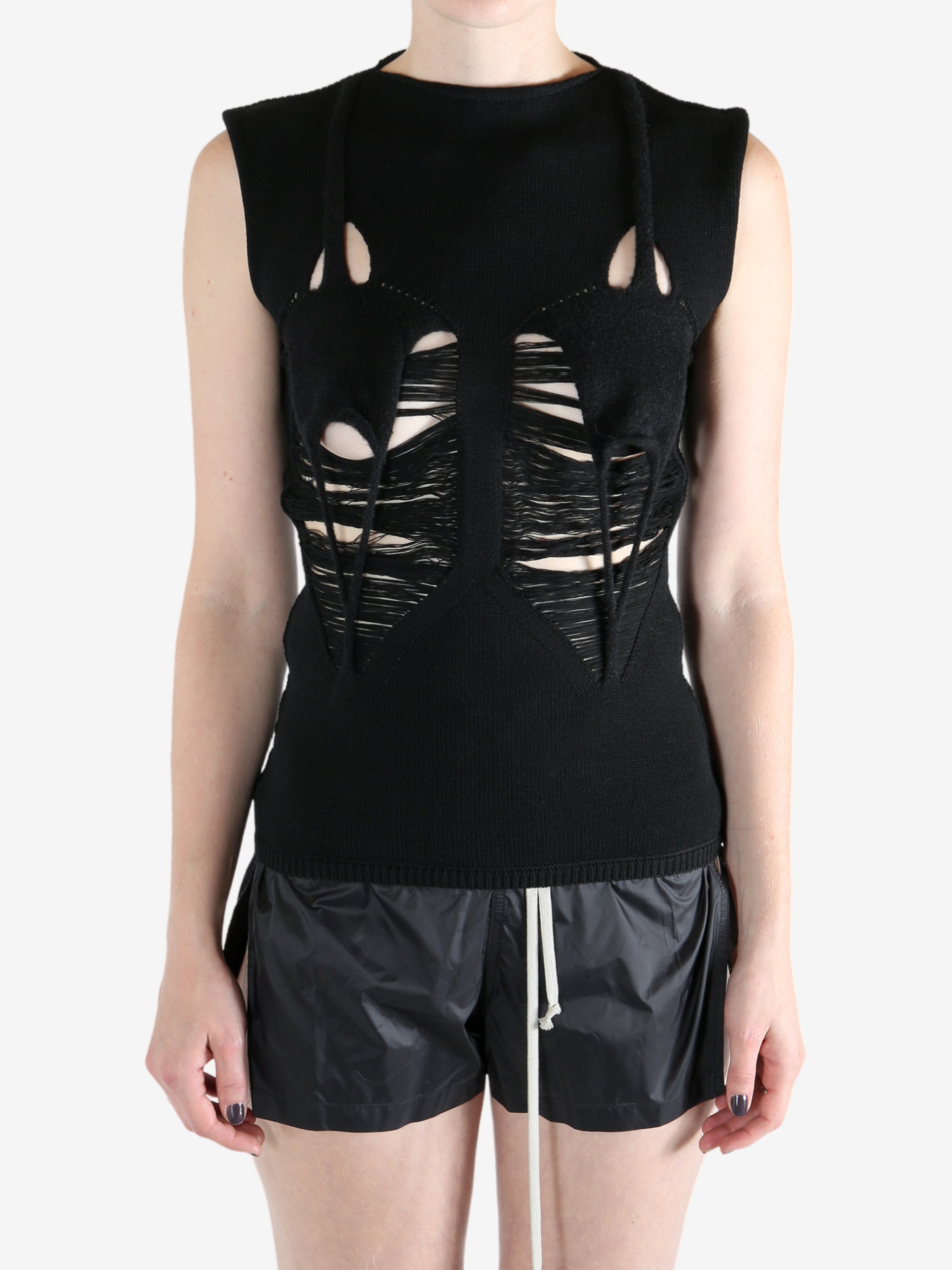 Black top worn by a person, showing the top's fit