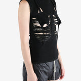 Black top worn by a person, showing the top's fit