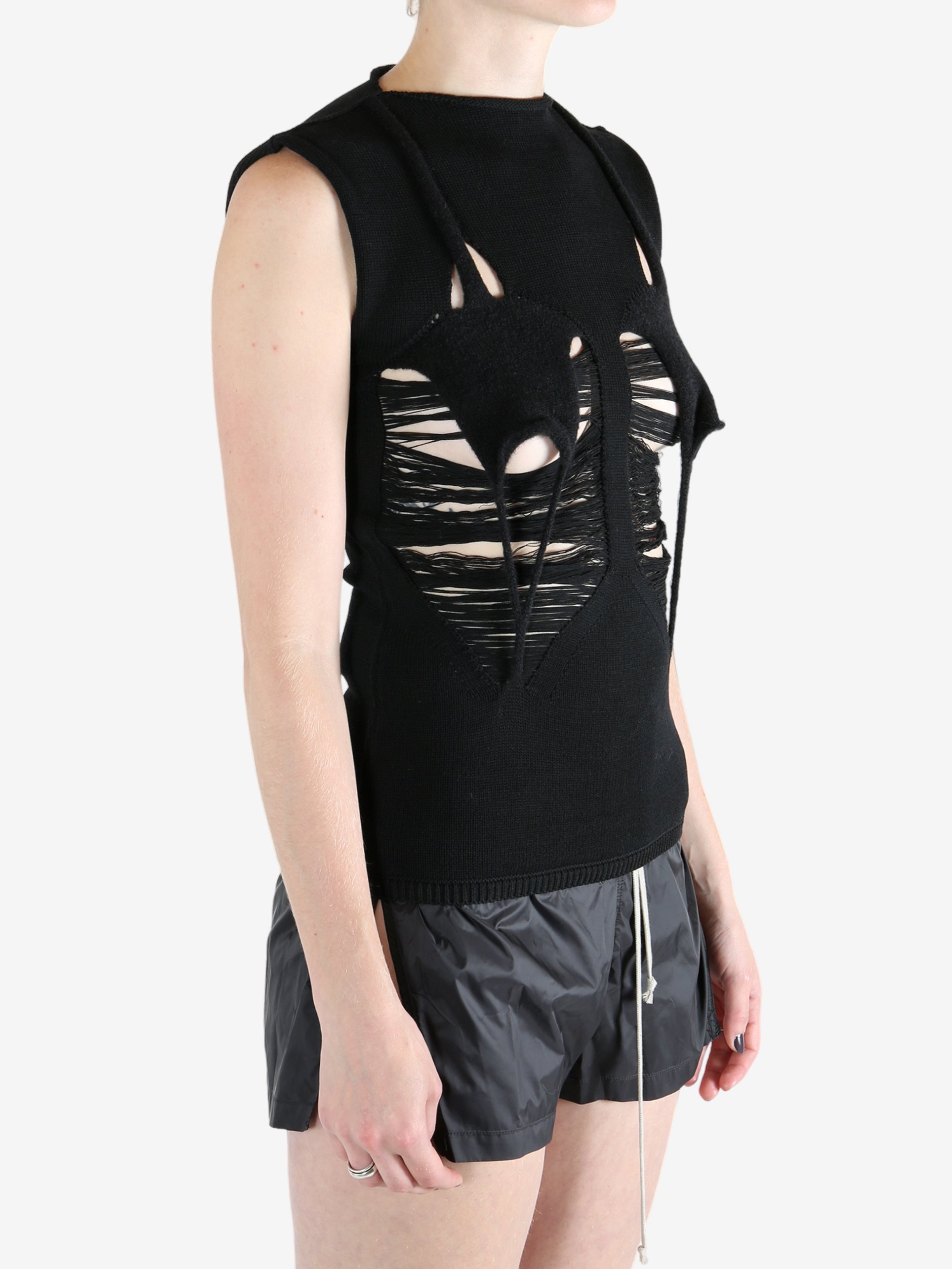 Black top worn by a person, showing the top's fit