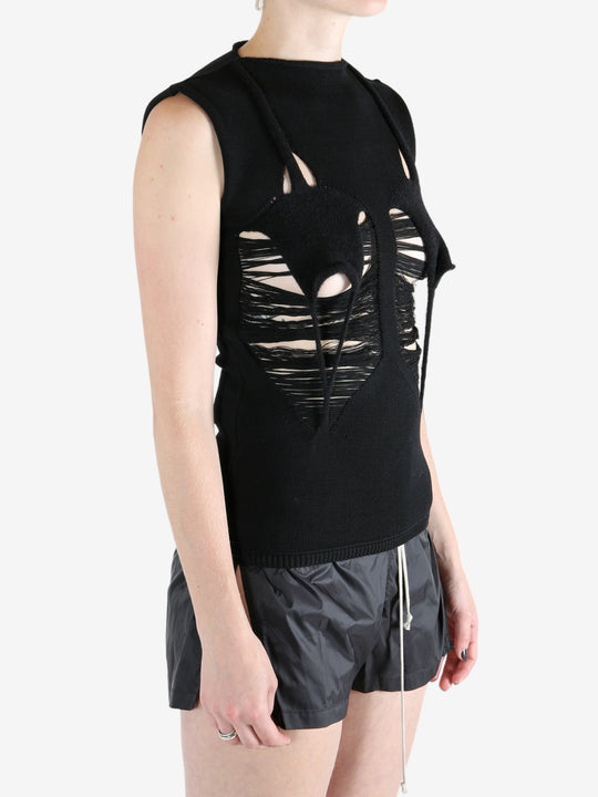 Black top worn by a person, showing the top's fit