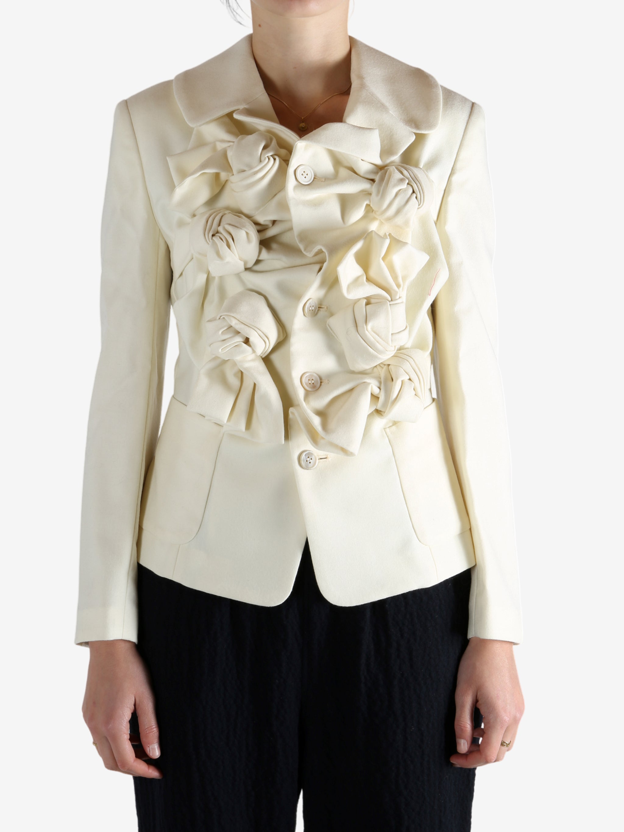 White jacket worn by a person, showing the jacket's fit