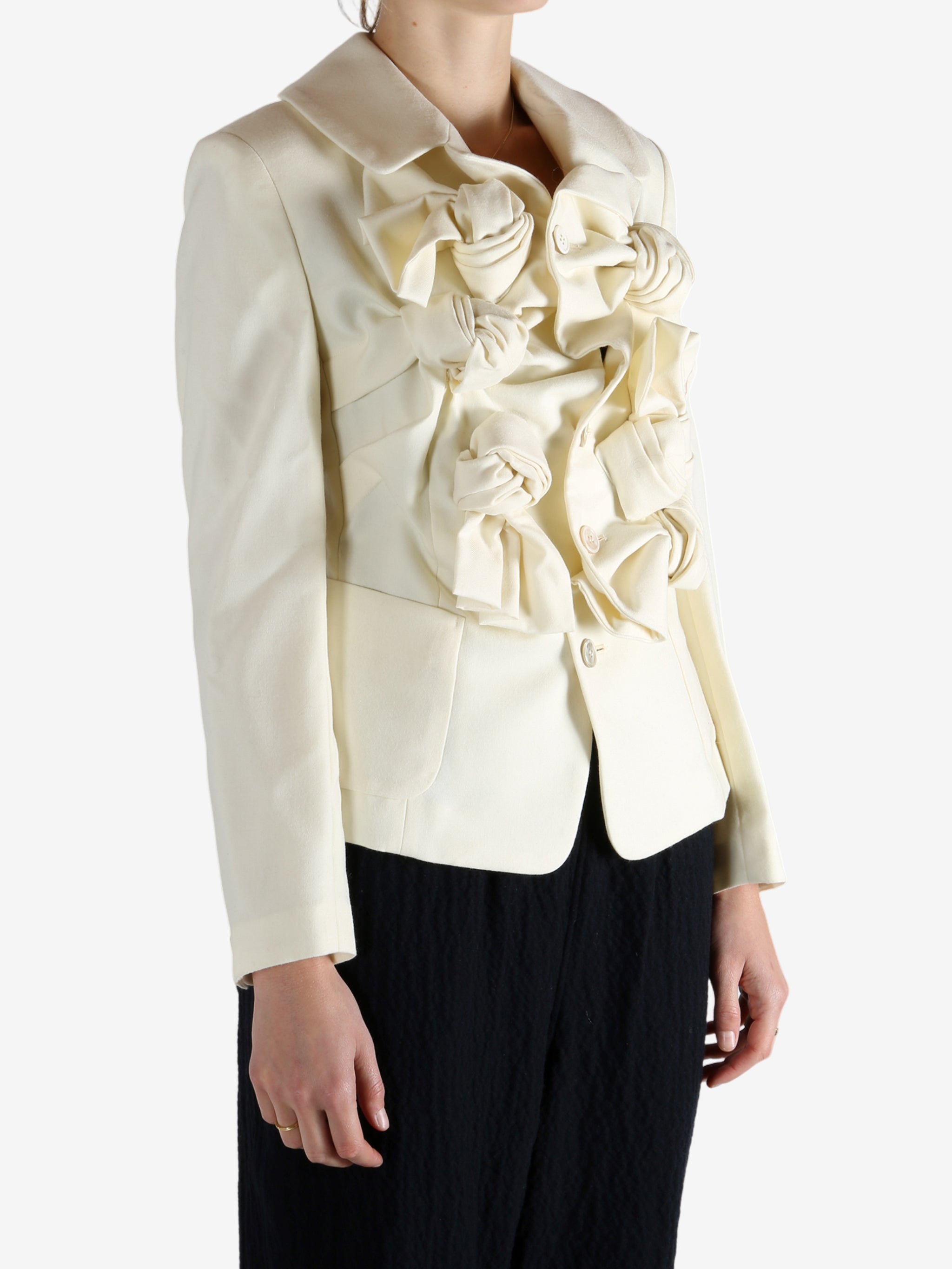 White jacket worn by a person, showing the jacket's fit
