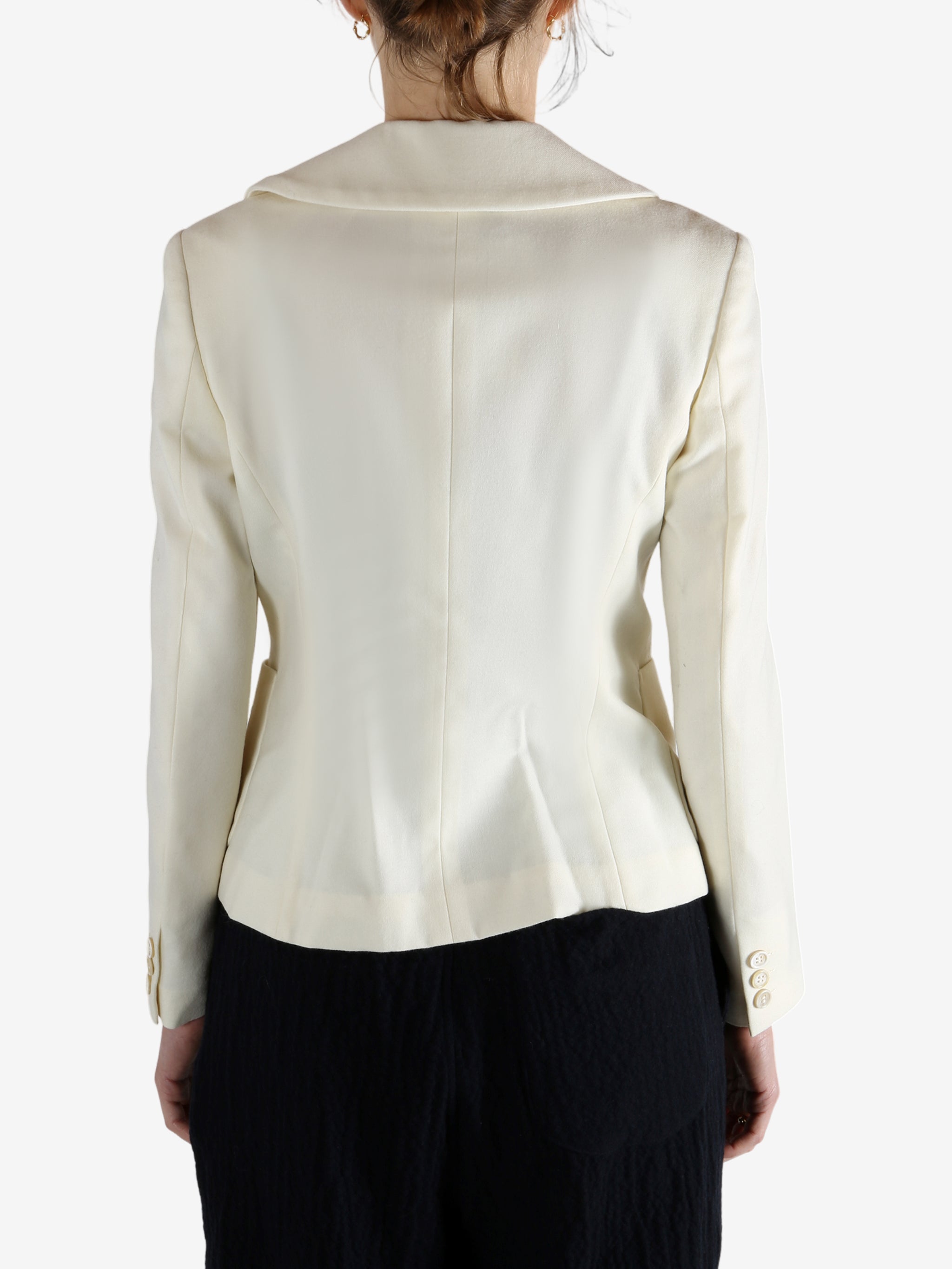 White jacket worn by a person, showing the jacket's fit